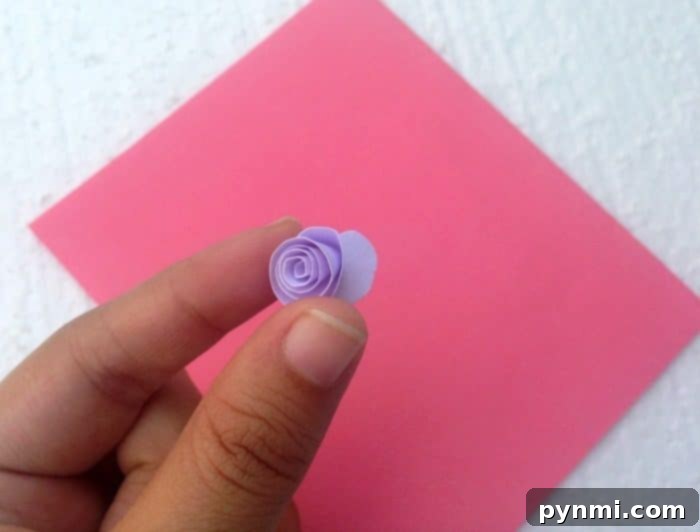 Crafting a Pop Up Heart Card 5 Image showing the continuous spiral cut being made into a paper circle, creating a long paper strip