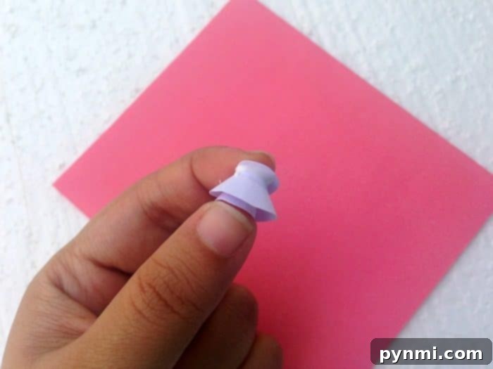 Crafting a Pop Up Heart Card 6 Visual guide demonstrating how to start rolling the spiral paper from the outside edge to form a tight flower bud