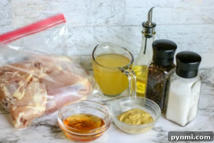 Close-up of boneless, skinless chicken thighs browning in an Instant Pot, a crucial step for locking in flavor and creating a rich base for the honey mustard sauce.