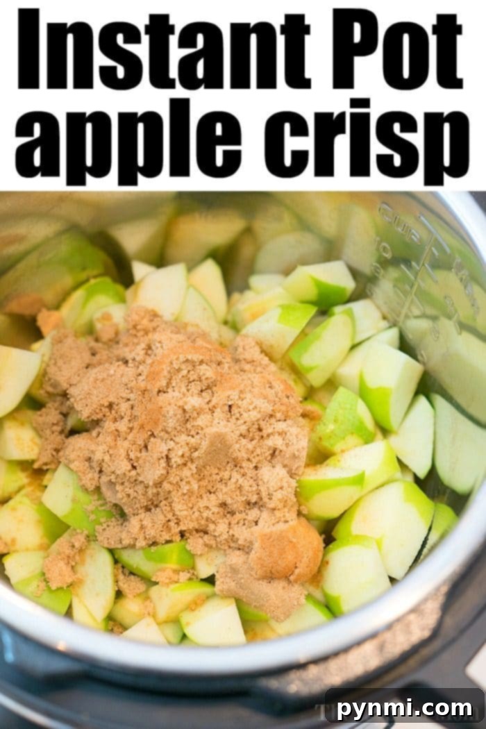 This Instant Pot apple crisp recipe is amazing! Tastes like copycat Cracker Barrel baked apples we love but made in less than 20 minutes total. Warm cinnamon apples coated with a ooey gooey brown sugar glaze your family will go crazy over for sure. Try this homemade pressure cooker fruit dessert this week! #instantpot #pressurecooker #apples #applecrisp #baked #dessert #pie Instant Pot apple crisp with perfectly cubed apples.