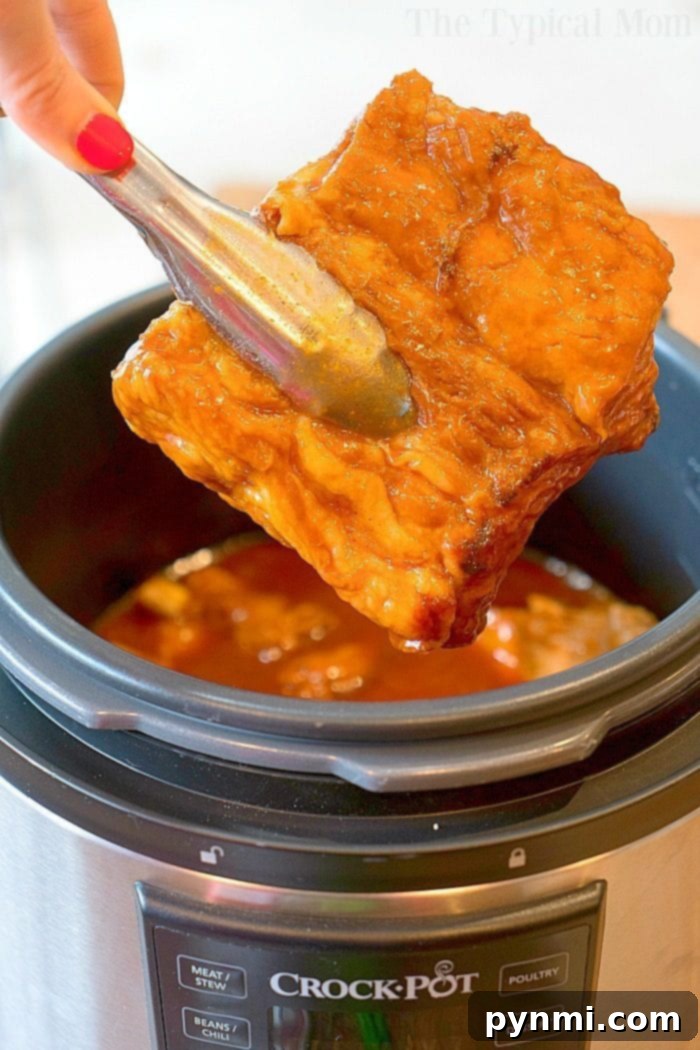 Fall-Off-The-Bone Express Ribs 4 Perfectly cooked, glazed ribs served fresh from the pressure cooker, showcasing their tender, juicy texture.