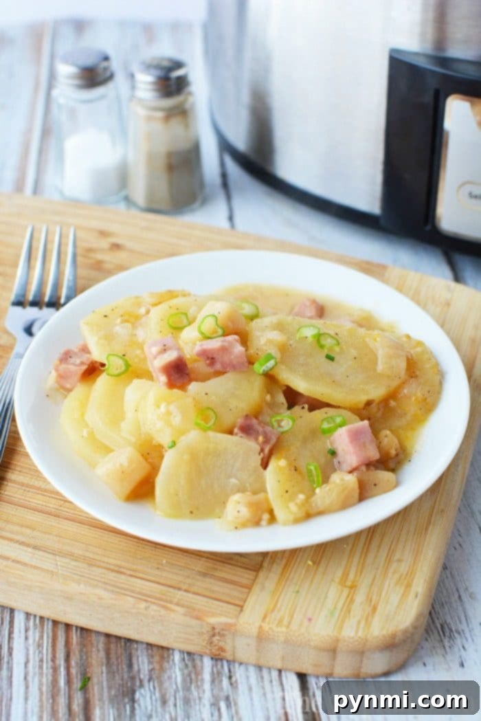 Slow Cooker Scalloped Potatoes with Ham: A Cheesy, Easy Side for Any Occasion Creamy Slow Cooker Scalloped Potatoes with Ham, perfect for holidays and family dinners.