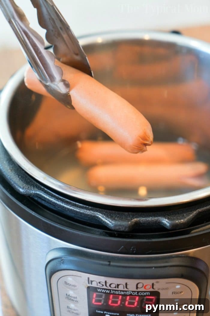 Instant Pot Hot Dogs cooked to perfection, ready for toppings.