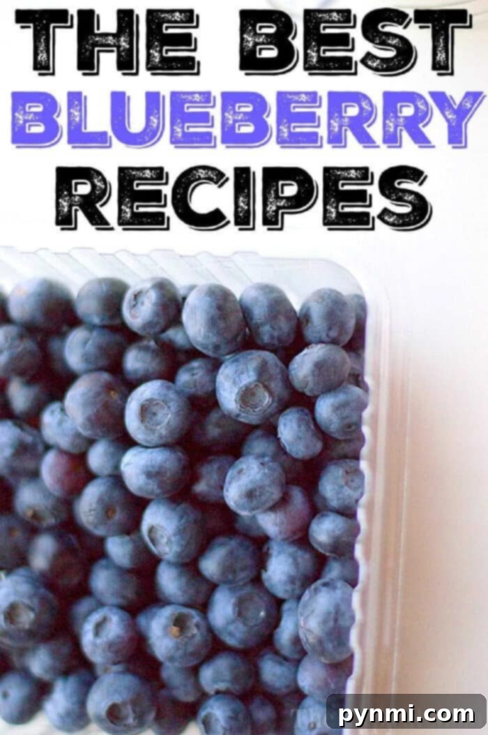 A vibrant display of fresh blueberries, some in a bowl, others scattered around, hinting at the delicious possibilities within the best blueberry recipes guide.