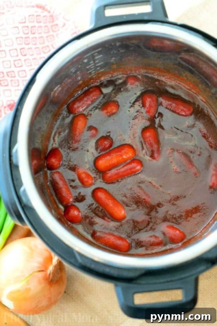 Delicious Instant Pot cocktail wieners in a rich sauce, ready to be served as a party appetizer.