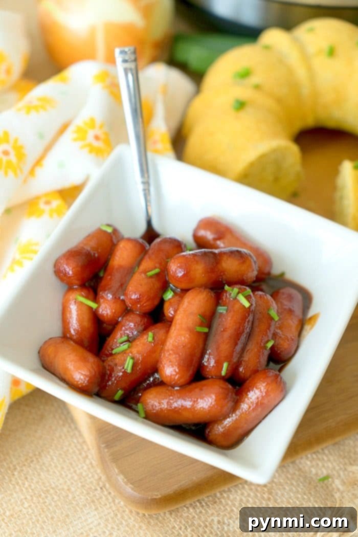 Instant Pot cocktail wieners in a pot with a ladle, ready for serving at a party.