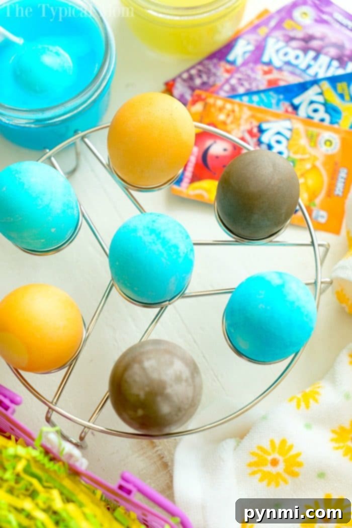 How to Dye Eggs With Kool Aid - Vibrant Blue, Orange, Red Eggs on a Rack
