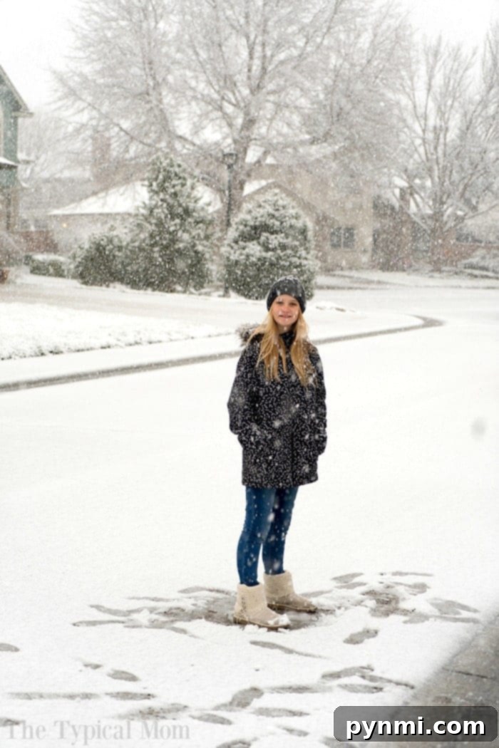 Children playing in unexpected late spring snow, highlighting the unpredictability of allergy triggers.