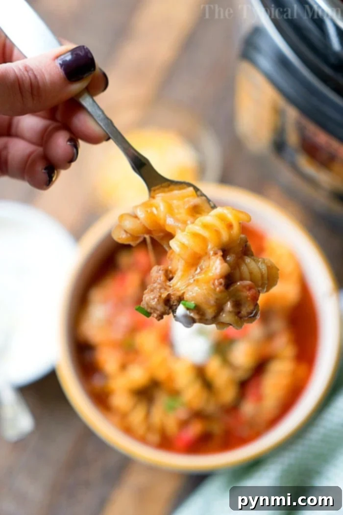 A large serving of Instant Pot taco casserole in a pan, ready to be dished out.