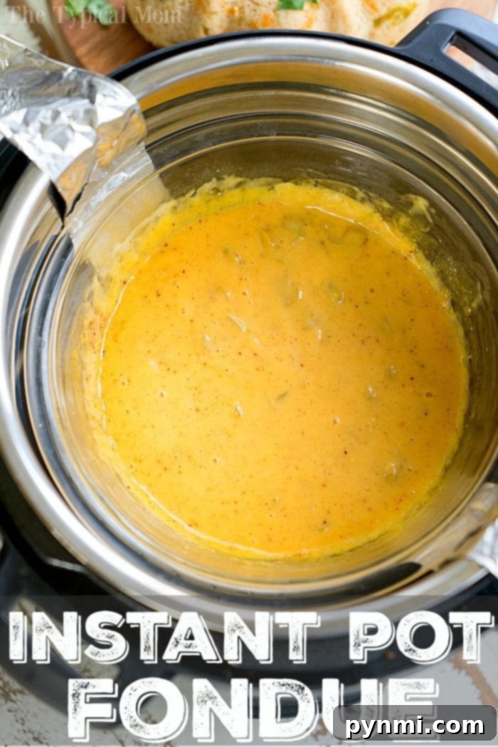 Close-up of golden cheese fondue in a bowl, with an Instant Pot blurred in the background.