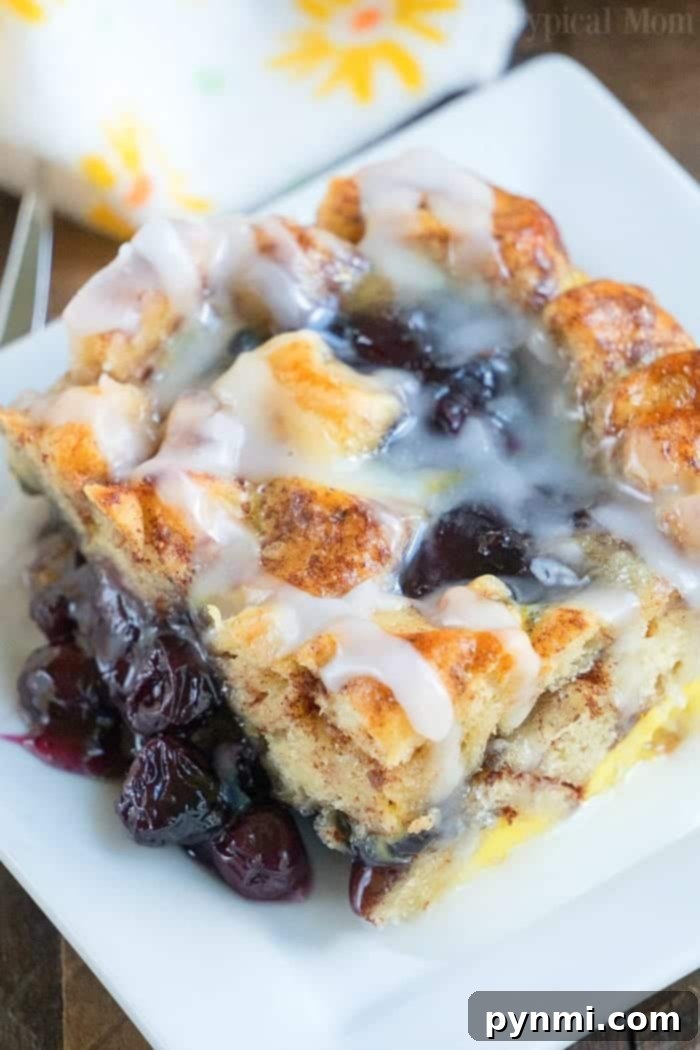 Cinnamon roll breakfast casserole with blueberries is just amazing! Served for brunch or on Christmas morning it is a great way to make cinnamon rolls into a fruit casserole that everyone will love. Feeds 12 and costs under $10 to make which is a winner in my book! #cinnamonroll #casserole #breakfast #blueberry #fruit #easy Cinnamon Roll Breakfast Casserole with fresh blueberries