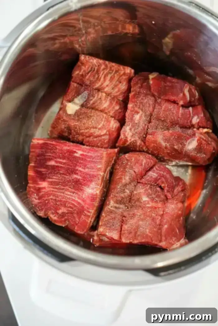 Instant Pot Pulled Beef - Tender and succulent, ready for your favorite dishes.
