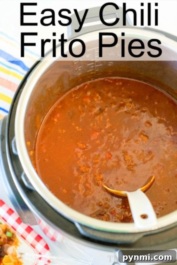 Instant Pot filled with delicious chili, titled "Easy Chili Frito Pies," showcases the perfect Instant Pot Frito Chili Pie recipe, complete with a serving spoon inside.