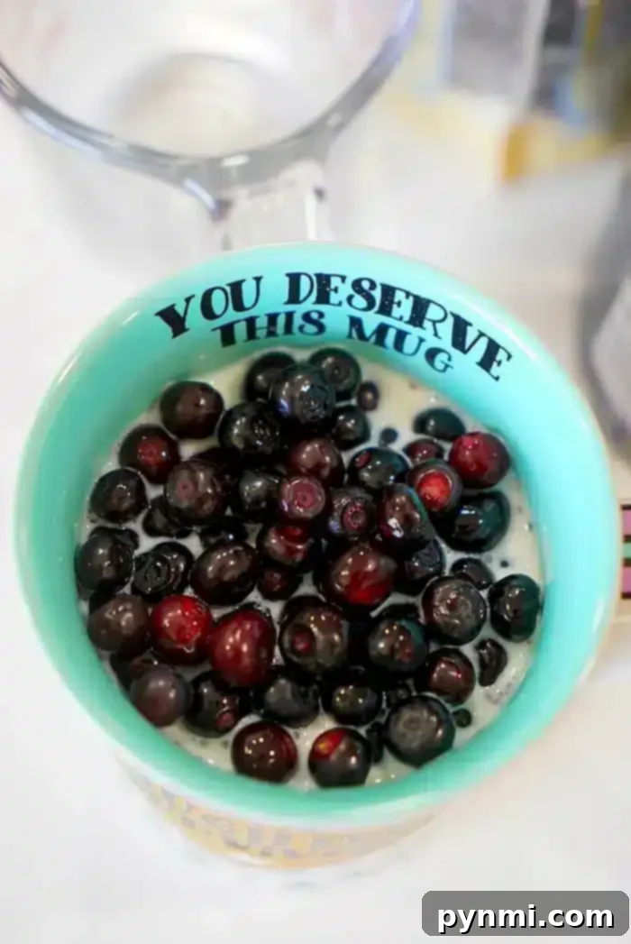 Two glasses of creamy dairy-free chia seed pudding with milk, ready to be enjoyed.