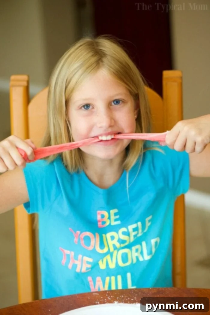 Discover Slime Without Glue 2 A child's hands playing with vibrant, colorful edible slime, emphasizing safe and tasty sensory play.