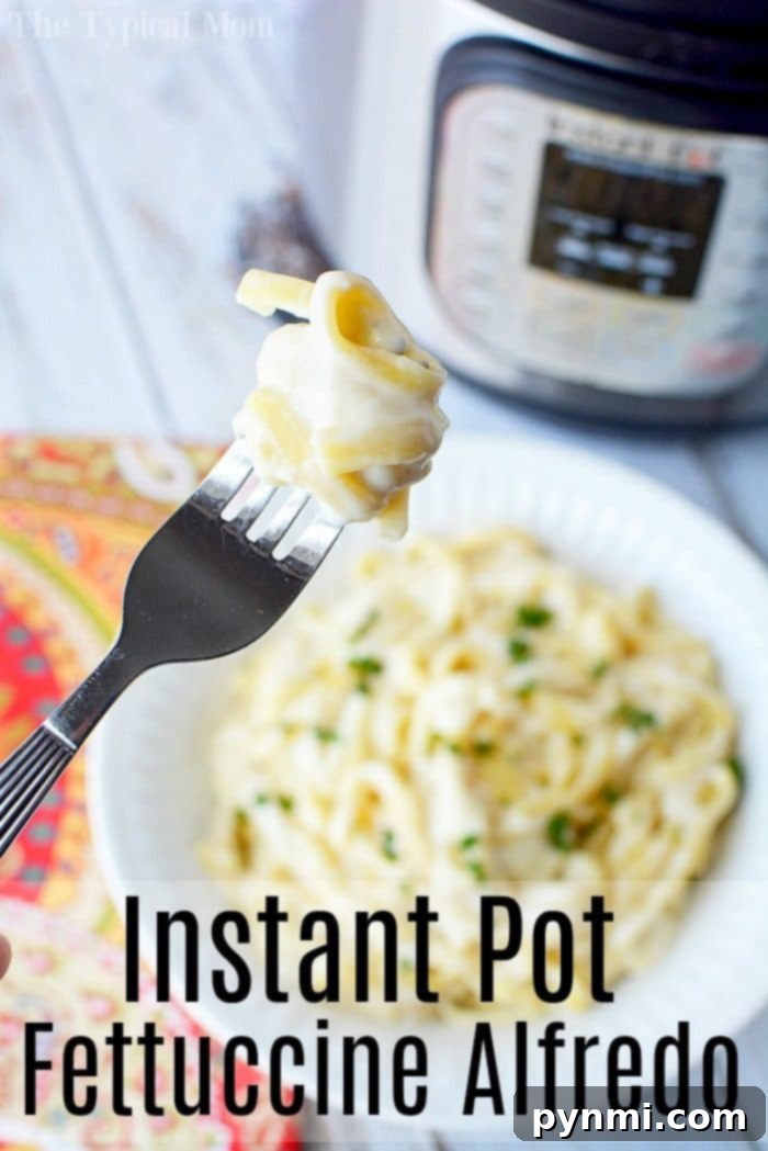 This Instant Pot fettuccine alfredo recipe is easy to make and a creamy buttery dinner your whole family is sure to love. Inexpensive pressure cooker meal. #instantpot #instantpotrecipes #alfredo #fettuccinealfredo #pasta #easy Instant Pot Fettuccine Alfredo, served in a bowl with parsley garnish.