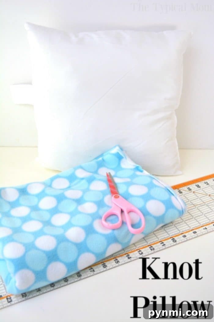Essential tools and materials for making a knot pillow, including fleece fabric, scissors, and a ruler.