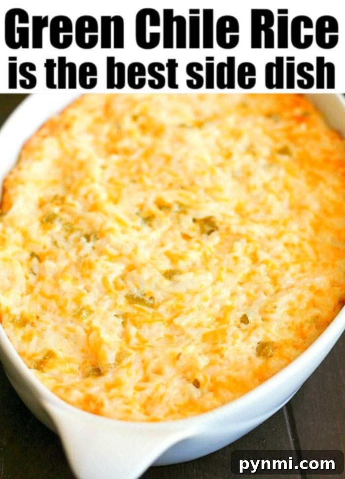 Green chile rice recipe side dish you can make during the holidays or throughout the year for dinner. Cheesy and full of flavor! #green #chile #chiles #hatch #casserole #rice A close-up shot of a bubbling, baked green chile rice casserole, topped with golden-brown melted cheese, in a white ceramic dish.