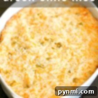 A bubbling white casserole dish reveals a golden crust, nestled over the savory delight of green chile rice beneath.
