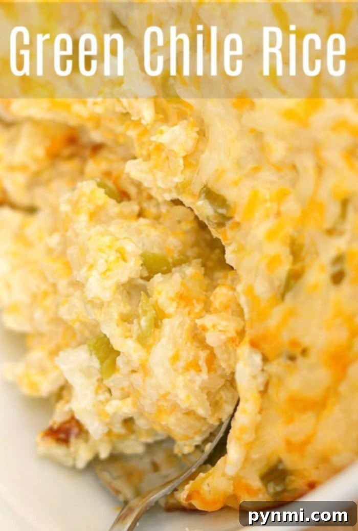 Here's a great green chile rice side dish you can make and serve during the holidays or throughout the year for dinner. Cheesy and full of flavor! #green #chile #chiles #hatch #casserole #rice A large white oval dish filled with creamy green chile rice, garnished with fresh cilantro, ready to be enjoyed.
