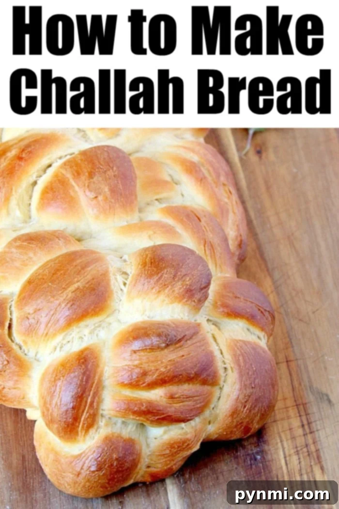 Mastering the Art of Challah Baking 5 Close-up of a golden Challah bread loaf cooling on a wire rack, freshly baked and glistening.
