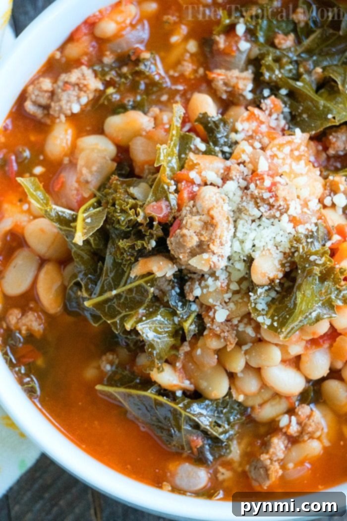 Instant Pot sausage soup is packed with flavor and can be made with or without kale. Using canned or dry beans it's the perfect dinner. #instantpotrecipes #sausagesoup #soup #kale #pressurecooker #instantpot #thetypicalmom #drybeans #sausage instant pot sausage soup