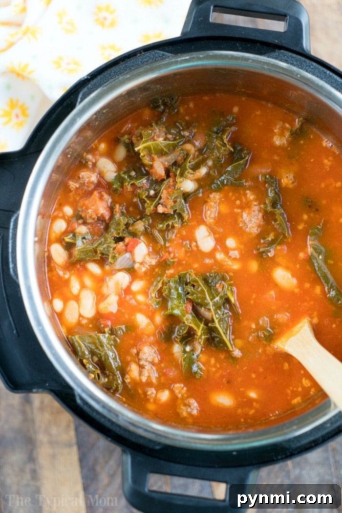 Pressure cooker sausage soup is packed with flavor and can be made with or without kale. Using canned or dry beans it's the perfect dinner. #instantpotrecipes #sausagesoup #soup #kale #pressurecooker #instantpot #thetypicalmom #drybeans #sausage pressure cooker sausage soup 2