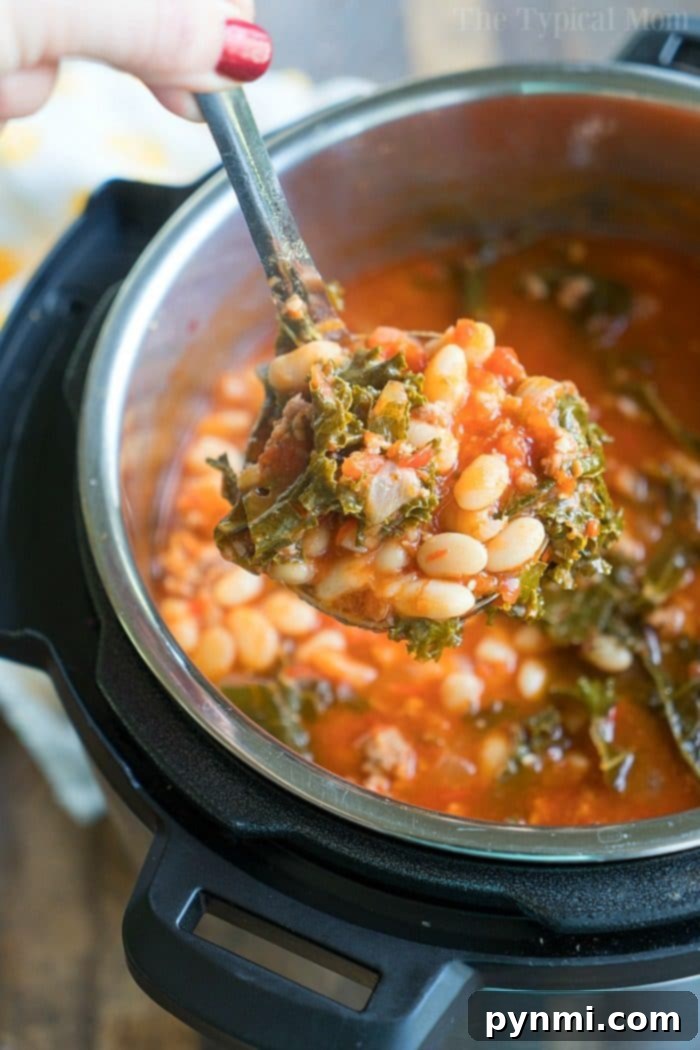 Pressure cooker sausage soup is packed with flavor and can be made with or without kale. Using canned or dry beans it's the perfect dinner. #instantpotrecipes #sausagesoup #soup #kale #pressurecooker #instantpot #thetypicalmom #drybeans #sausage A ladle scooping hearty sausage and white bean stew with greens from a pressure cooker.