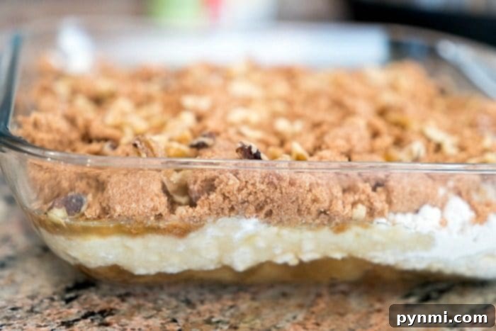 Scoops of easy apple dump cake on a white plate, ready to be served.