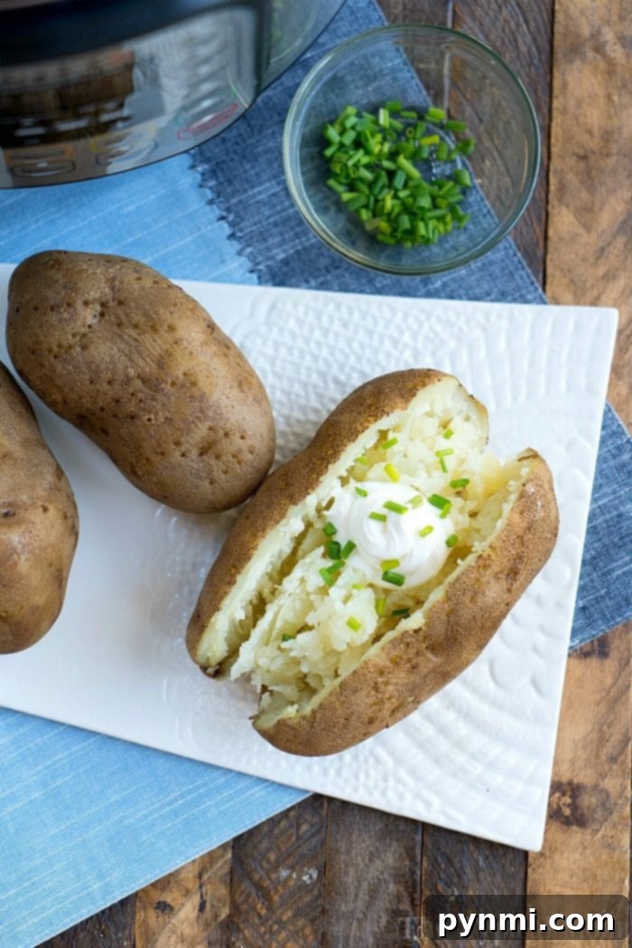 These pressure cooker baked potatoes and stuffed chicken are a great duo! Instant Pot dinner success again. #pressurecooker #instantpot #bakedpotatoes #potatoes #sidedish #instantpotrecipes #thetypicalmom Pressure cooker potatoes, tender and ready to be served.