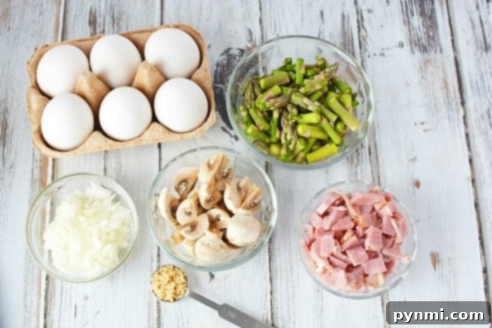 This asparagus casserole recipe is great! A cheesy casserole that is great with leftover ham inside, the perfect breakfast casserole to start the morning. #asparagus #casserole #ham #leftoverhamrecipes #leftoverham #egg #cheese #breakfastcasserole #breakfastbake Asparagus Casserole