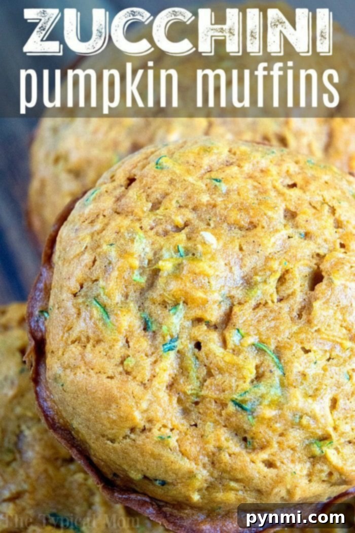 Moist Pumpkin Zucchini Bread - a comforting fall treat. A close-up of a pumpkin zucchini bread slice with a crumbly topping.