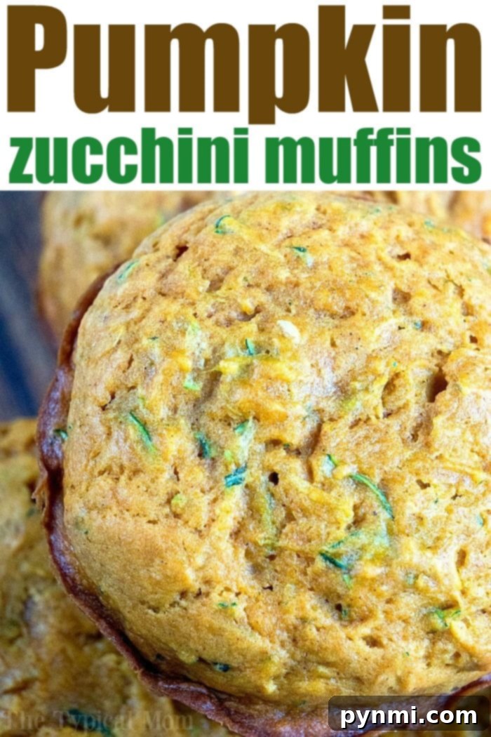 Moist and Flavorful Pumpkin Zucchini Muffins. Close-up of baked Pumpkin Zucchini Muffins, perfectly golden and inviting.