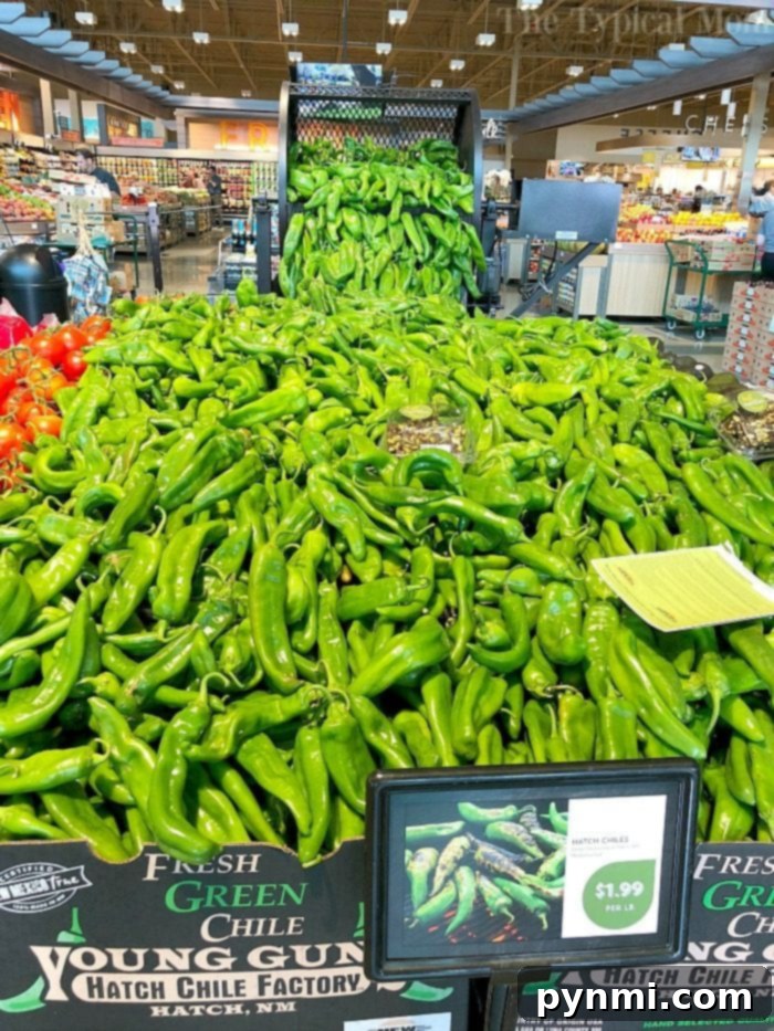 Fresh Hatch Chiles arranged on a surface, ready for preparation.