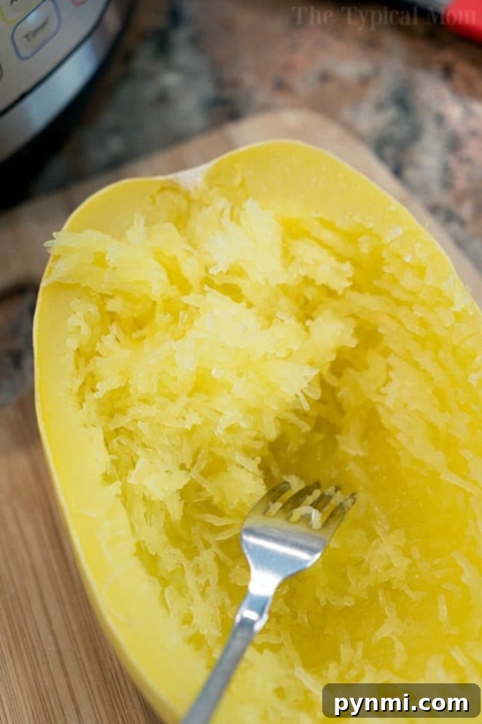 How to cook spaghetti squash fast, in just 7 minutes to be exact! Tender squash noodles are a healthy alternative for pasta and gluten free too. Instant Pot spaghetti squash is the best. #squash #spaghetti #instantpot #pressurecooker #baked #glutenfree #noodles #instantpotrecipes #thetypicalmom instant pot spaghetti squash