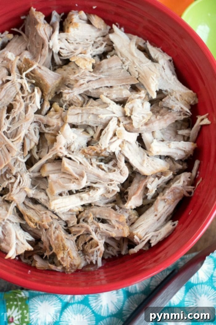 Sweet and Smoky Dr Pepper Slow Cooker Pulled Pork 3 Preparing tender pulled pork, showcasing the meat ready for slow cooking.