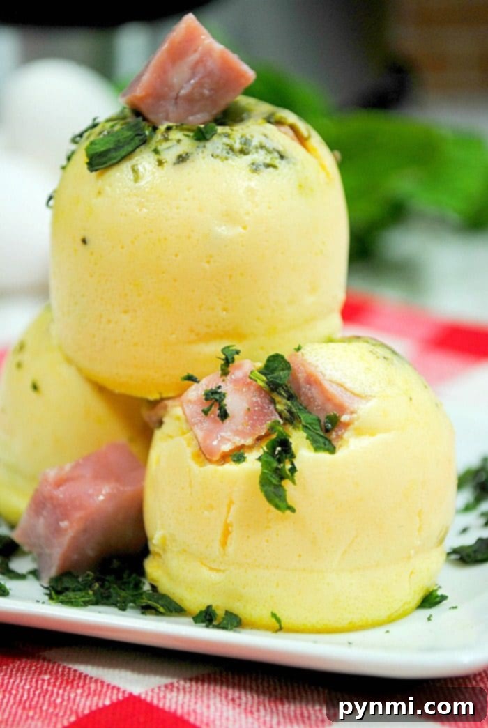 Make Starbucks sous vide eggs you love right at home now! It's never been easier to make your favorite egg bites in your Instant Pot or oven, here's how. #eggbites #starbucks #instantpot #instantpotrecipes #leftoverham #breakfast #copycat #keto #thetypicalmom Starbucks Sous Vide Eggs 2 - Close up of homemade egg bites