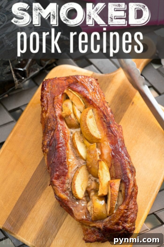 Succulent Smoked Stuffed Pork Loin 4 A beautifully smoked pork loin, generously adorned with tender apple slices, takes center stage. This close-up shot perfectly captures the golden-brown crust and succulent interior, embodying the essence of amazing smoked pork recipes.