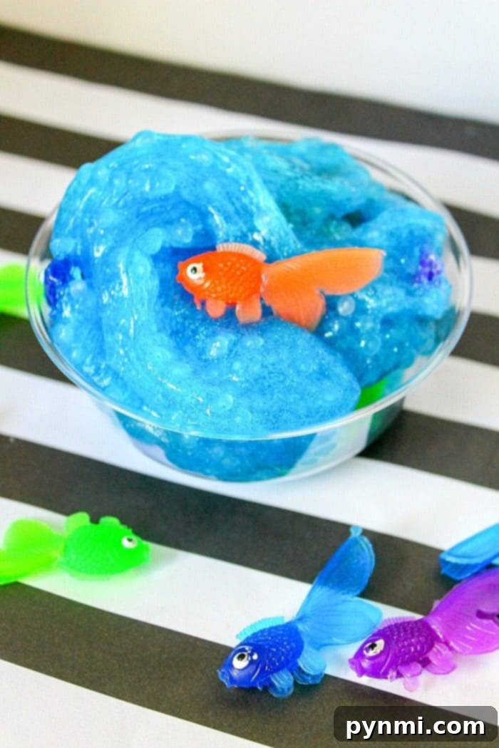 Close-up of vibrant blue fish slime, showcasing its translucent quality and embedded plastic fish