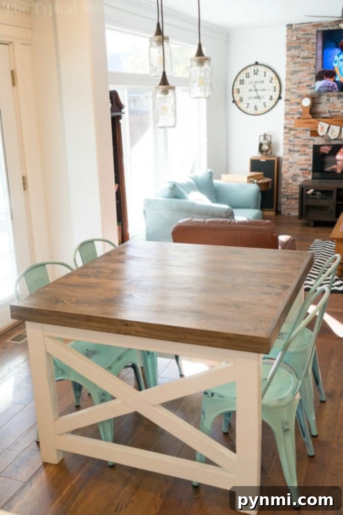 A closer look at our beautiful Farmhouse style table! Discover how we transformed our dark kitchen into a bright room with fun Farmhouse kitchen decor and a barn door pantry everyone loves! #farmhouse #decor #masonjar #barndoor #decorating #kitchen #table #lights #chairs Farmhouse Style Kitchen Table