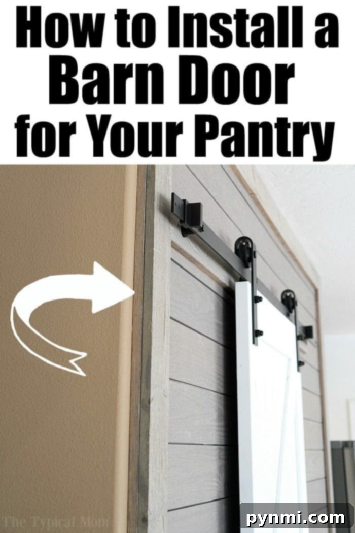 Our stunning pantry barn door was so simple to install! See how we brightened our dark kitchen with fun Farmhouse decor and this beloved barn door pantry! #farmhouse #decor #masonjar #barndoor #decorating #kitchen #table #lights #chairs Pantry Barn Door Installation