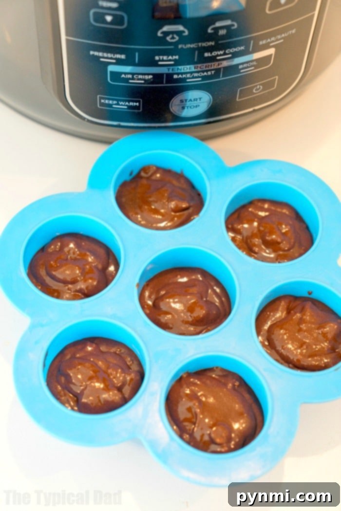 Fudgy Ninja Foodi brownies, showcasing the moist interior achieved through pressure cooking.