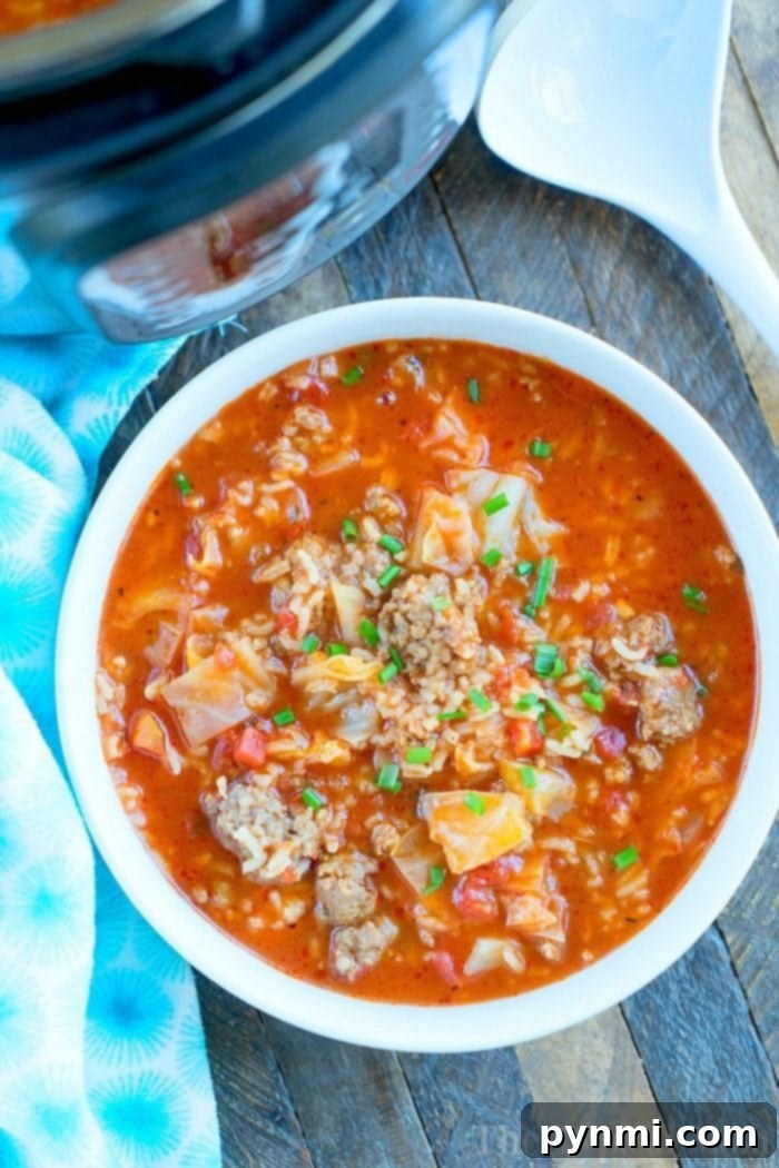 Hearty pressure cooker cabbage soup with ground sausage, tomatoes, and rice.