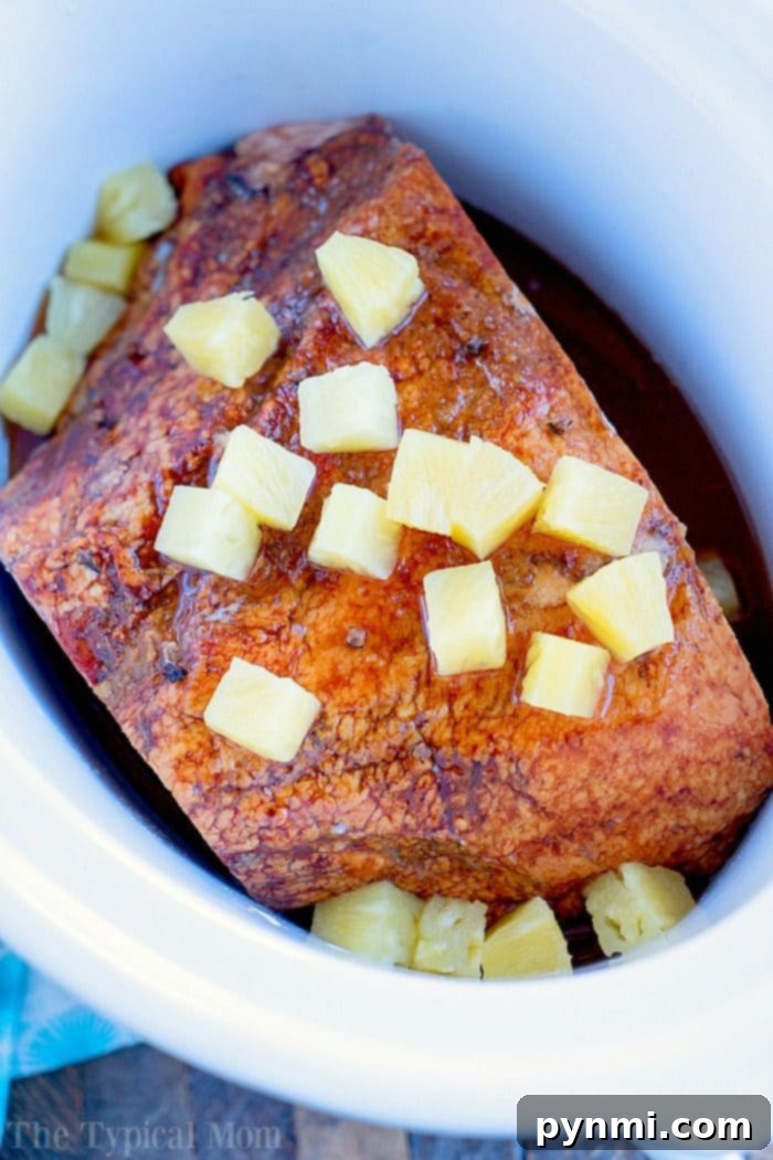 A delectable Crockpot ham, golden and succulent, showcasing the ease and deliciousness of slow cooker ham preparations.