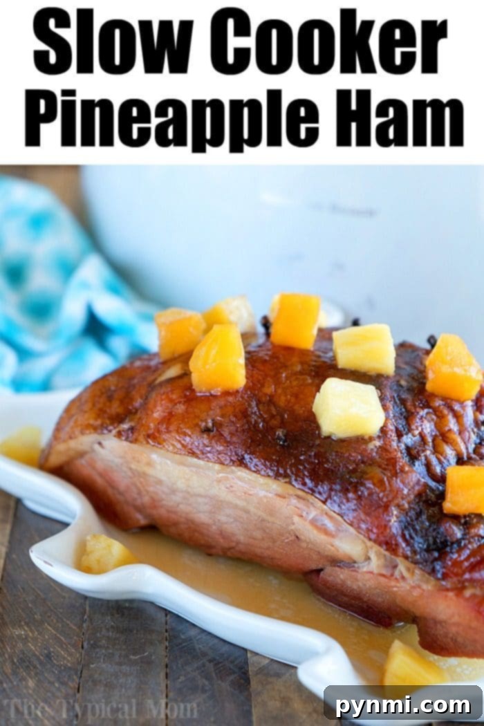 An appetizing serving of Crockpot Ham Recipe, showcasing tender slices alongside glazed pineapple, embodying the ultimate slow cooker ham experience.