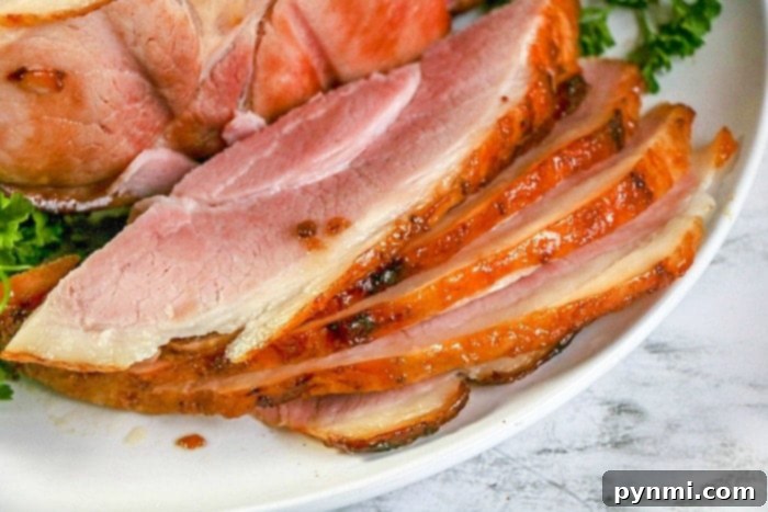 A succulent ham, perfectly cooked and ready to be carved, showcasing the tender results of a well-prepared ham for any occasion.