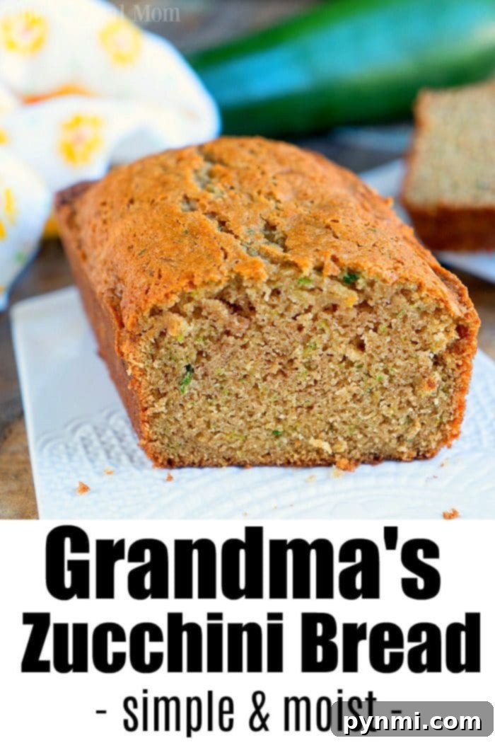 A beautifully baked loaf of Moist Zucchini Bread, sliced and ready to serve.