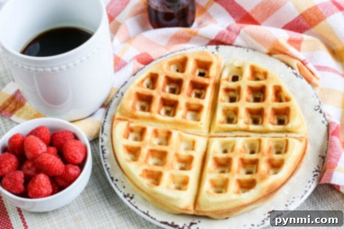 Interactive Food Bars for Your Christmas Brunch Party A stack of perfectly golden homemade waffles, ready for various toppings at a Christmas brunch