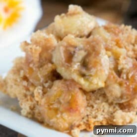No-Fuss Banana Delight 2 Close-up of banana dump cake, featuring caramelized bananas served on a square white plate.