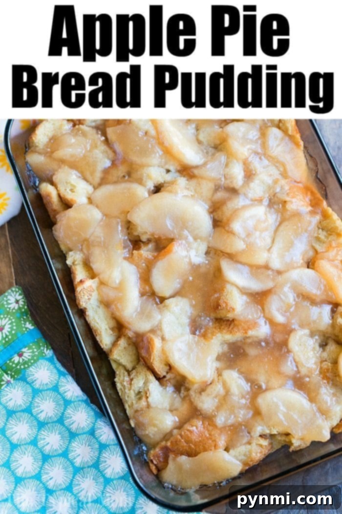 Spiced Apple Pie Bread Pudding 5 A warm, golden-brown apple pie bread pudding slice, topped with a sweet glaze, sitting on a white plate, ready to be enjoyed.